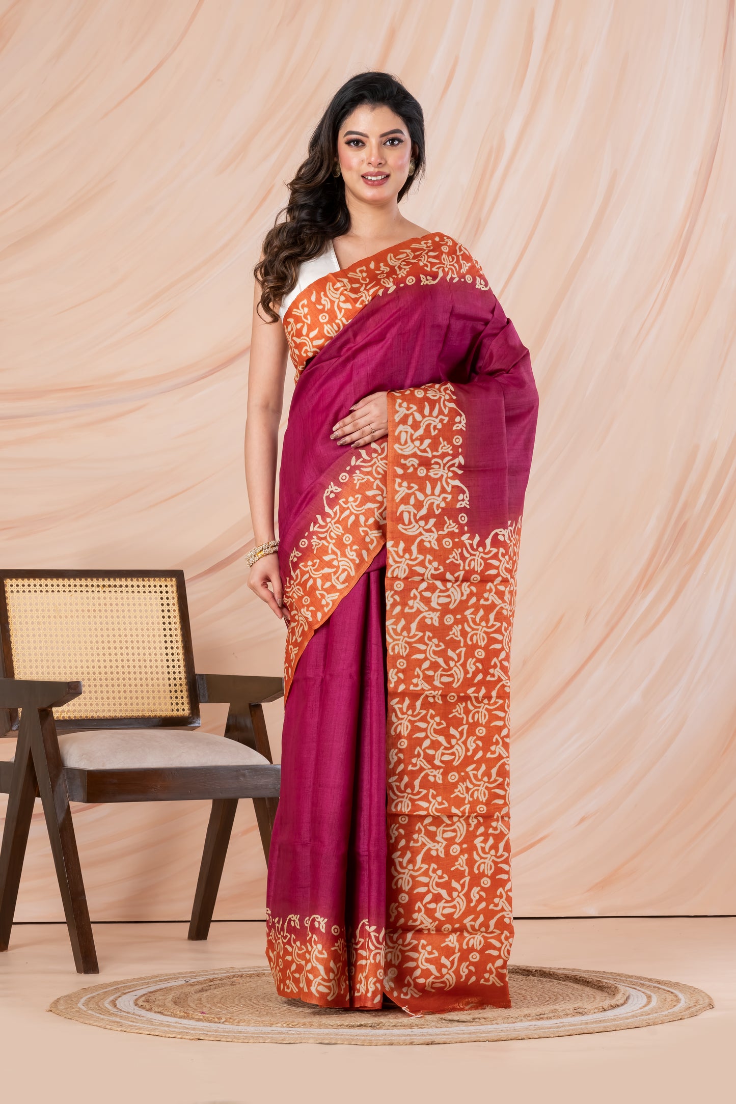 Deep pink with orange border tussar printed saree.
