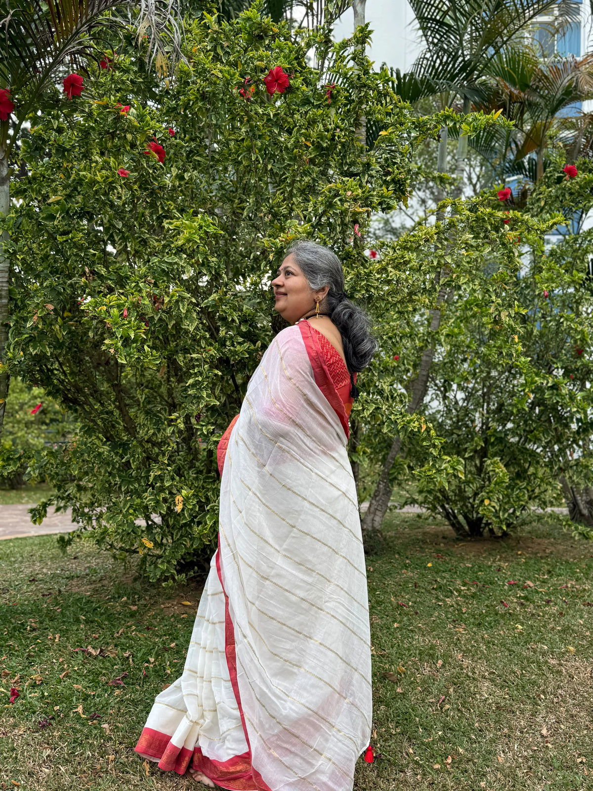 Off white red Kanchi border golden stripe saree