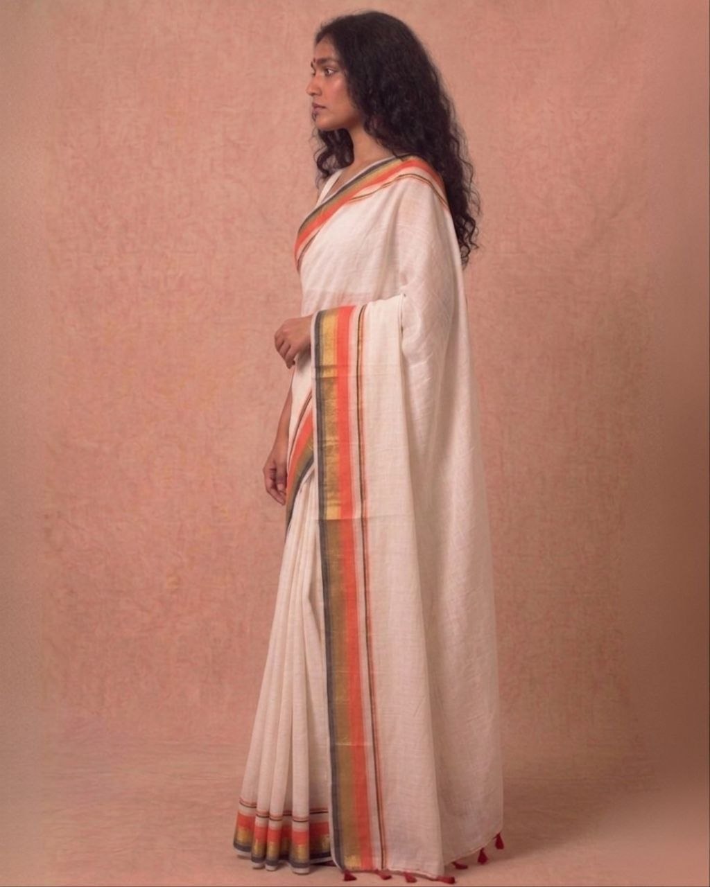 Off white orange zari border mulmul saree