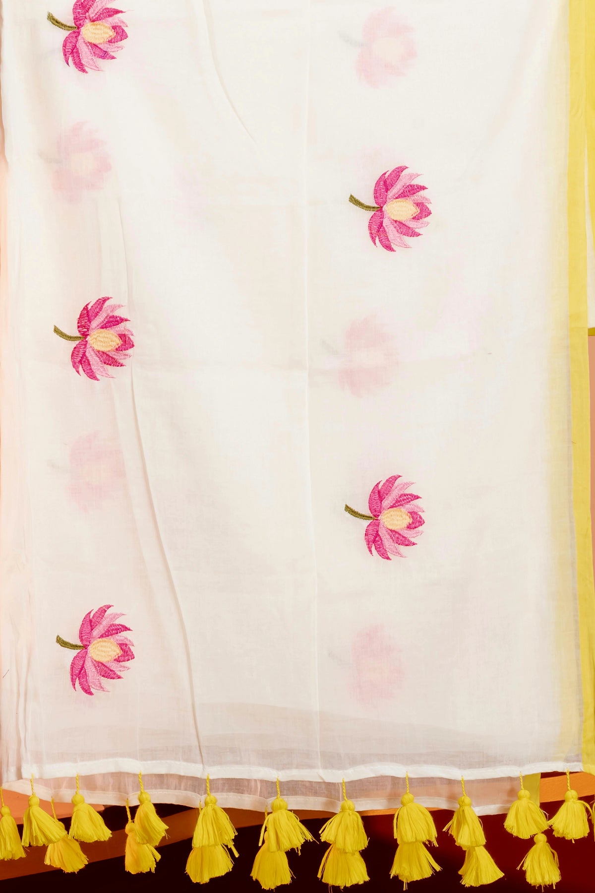 Lotus embroidered mul cotton saree with yellow selvage border