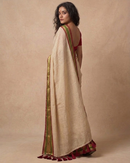 Off white green zari border mulmul saree