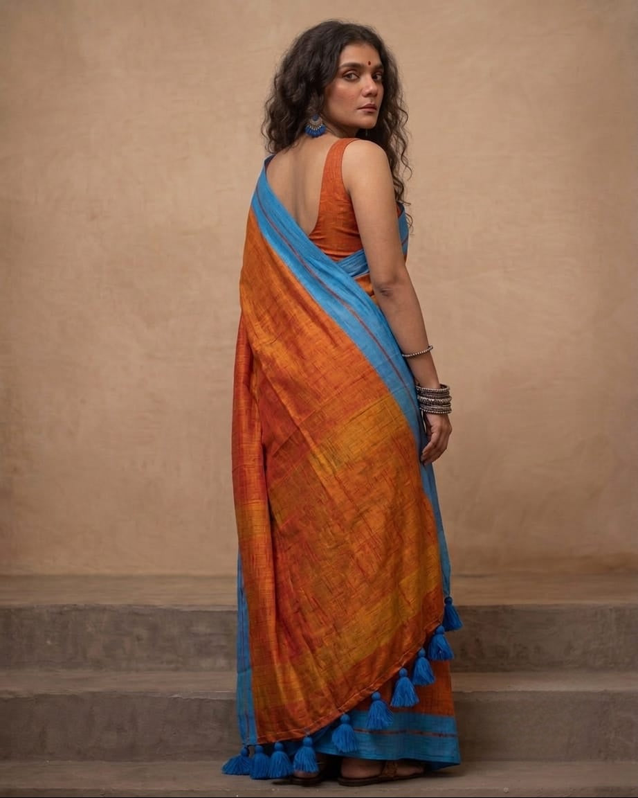 Orange mul cotton saree with blue border