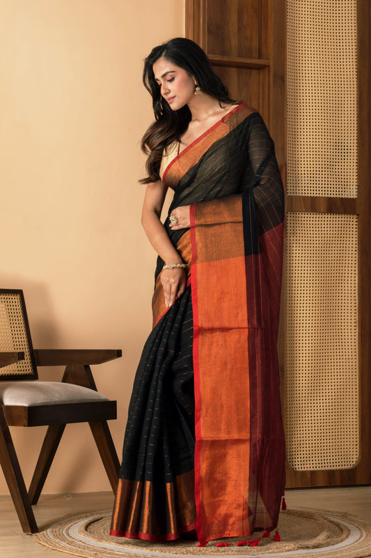 Black mul cotton saree with copper border and metallic stripes