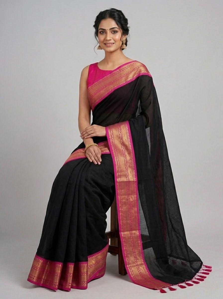 Classic black mulcotton saree with Contrast Pink and Gold Zari Border