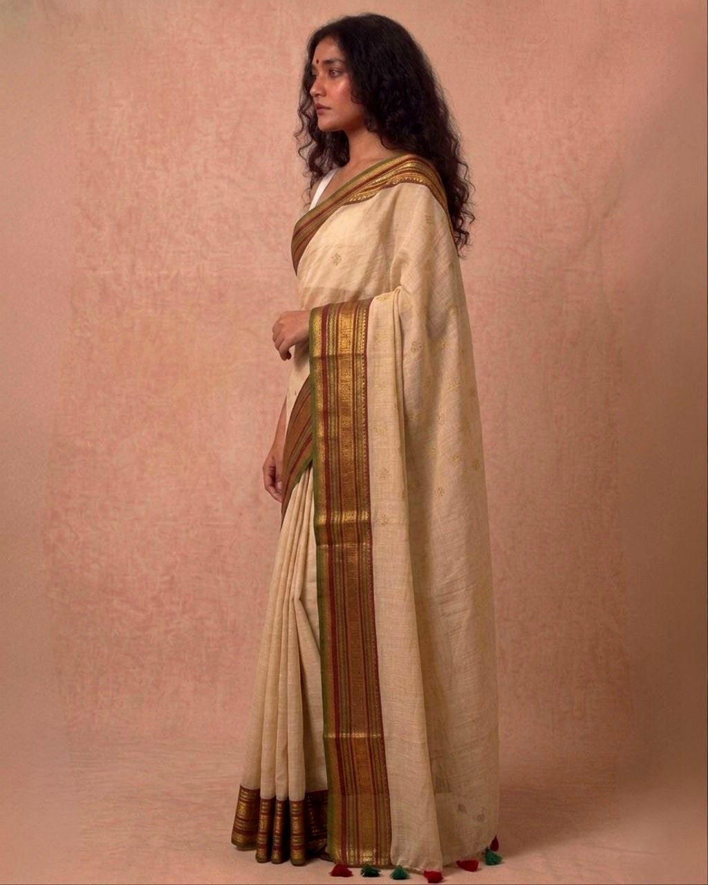 Off white multi color kanchi border mulmul saree