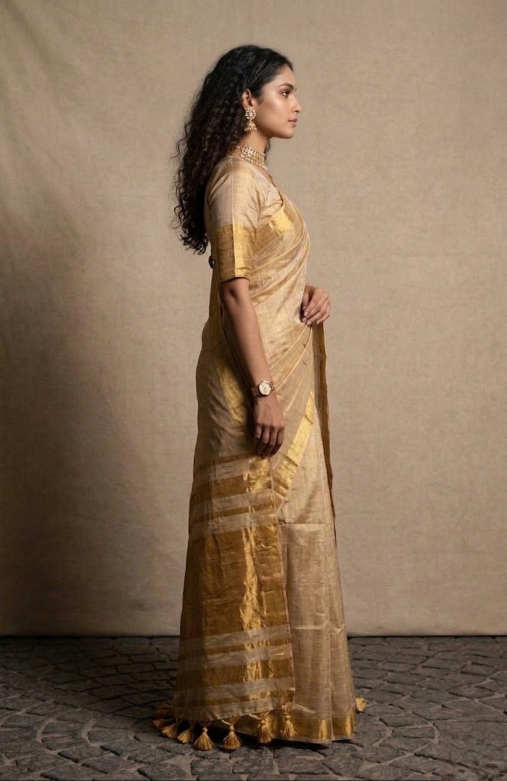 Beige golden zari border tissue kasavu saree