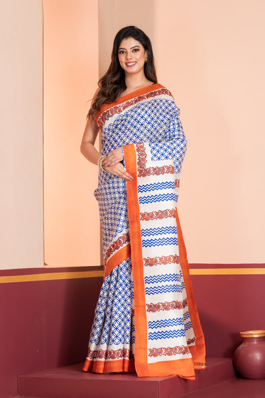 Pure printed silk with an orange border, paired with a plain orange blouse piece.