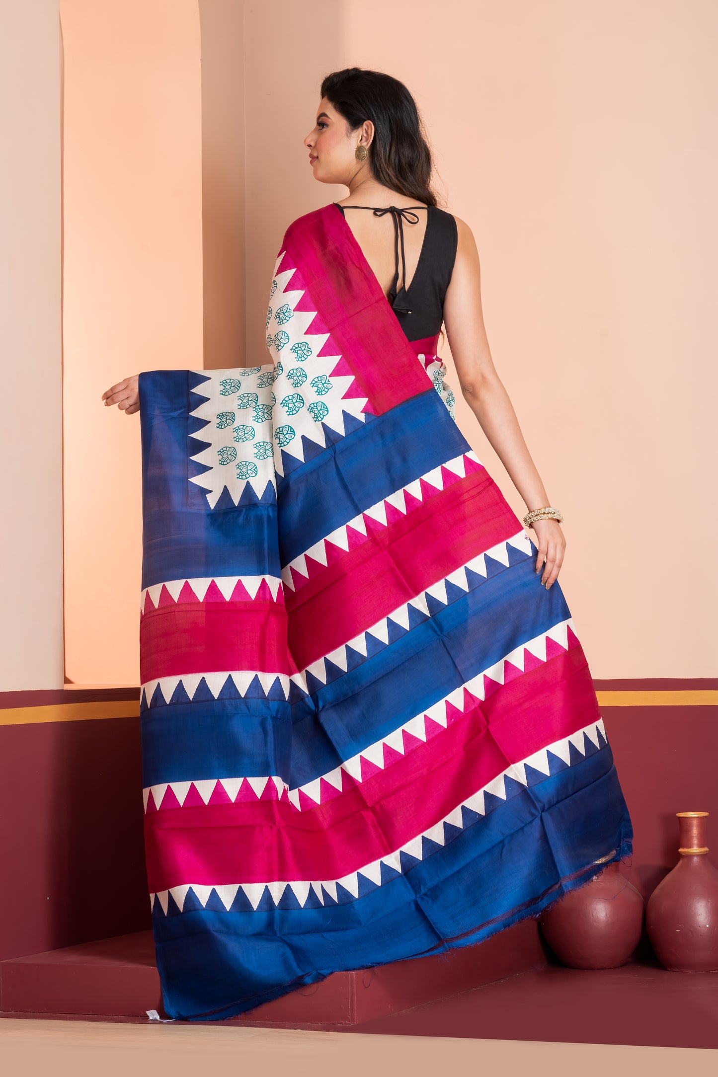 Deep pink and blue temple border, with owl motif prints.