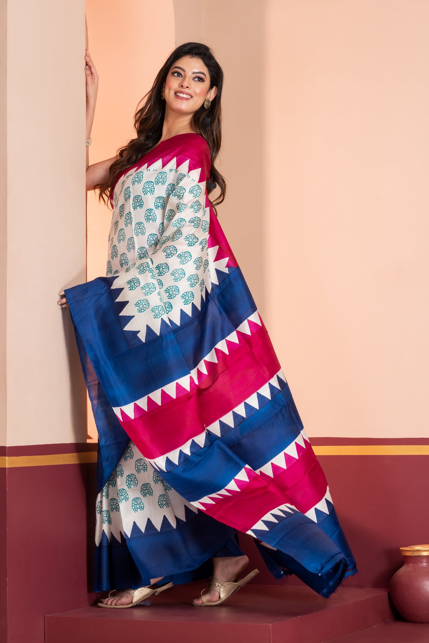 Deep pink and blue temple border, with owl motif prints.