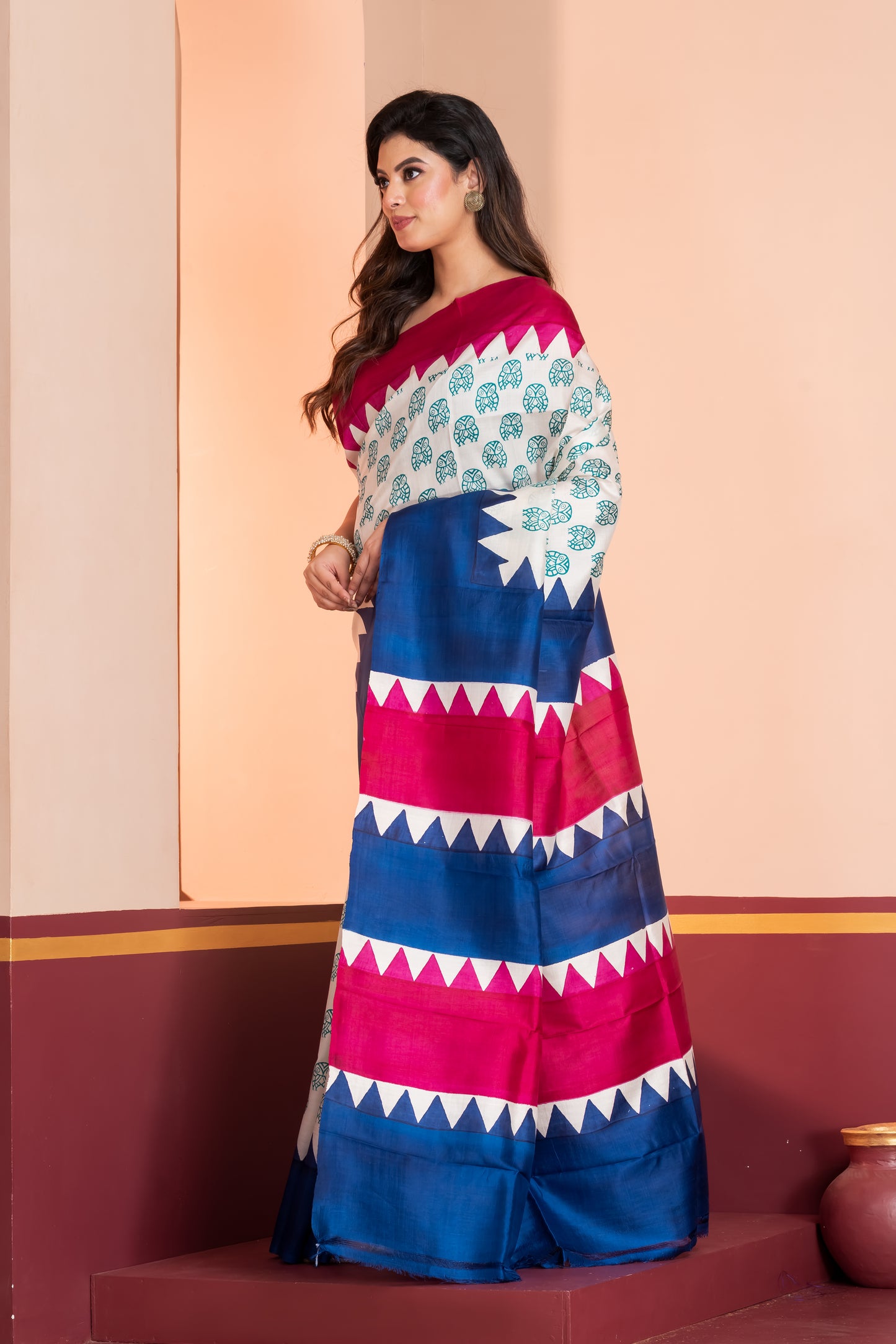 Deep pink and blue temple border, with owl motif prints.
