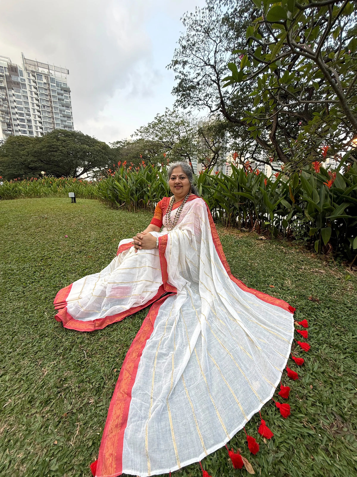 Off white red Kanchi border golden stripe saree