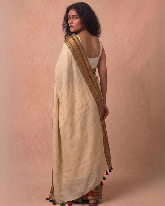 Off white multi color kanchi border mulmul saree