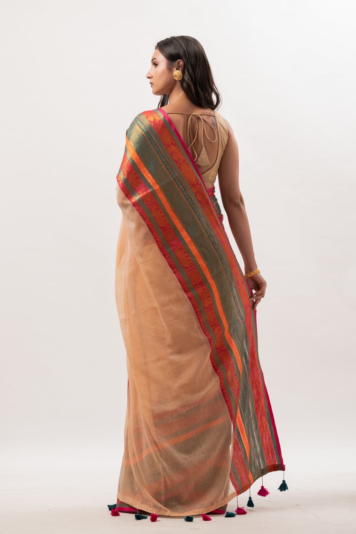Deep beige mul cotton saree with vibrant green n orange kanchi border