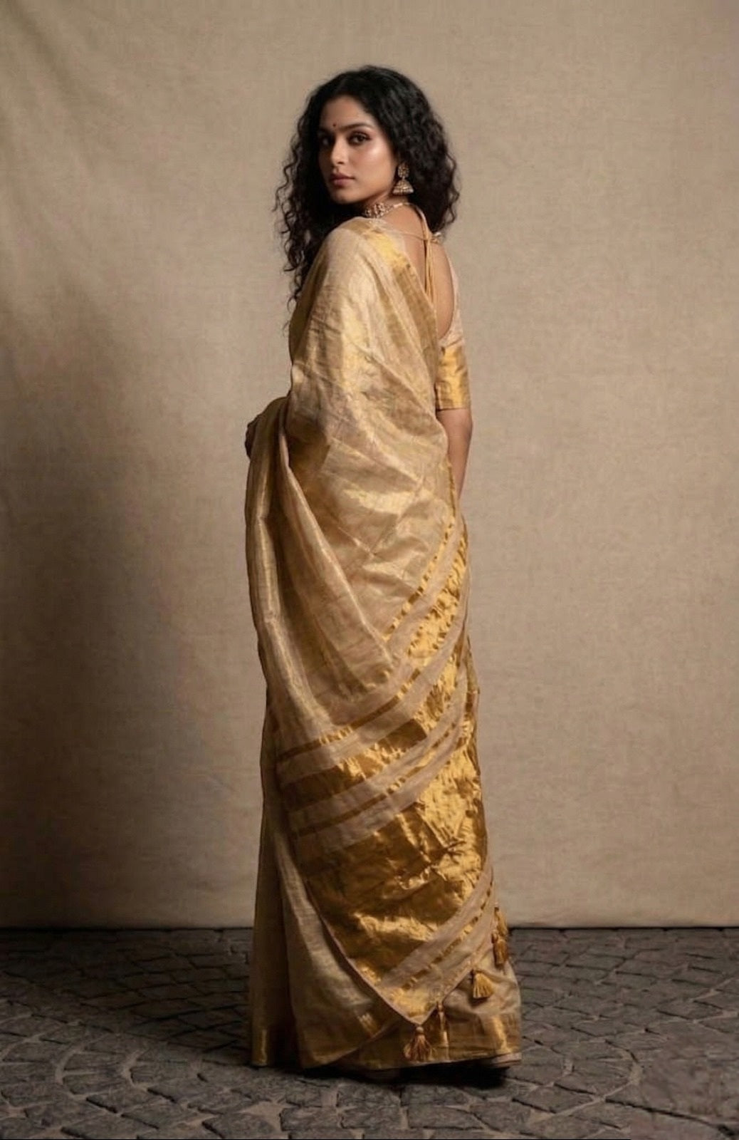 Beige golden zari border tissue kasavu saree