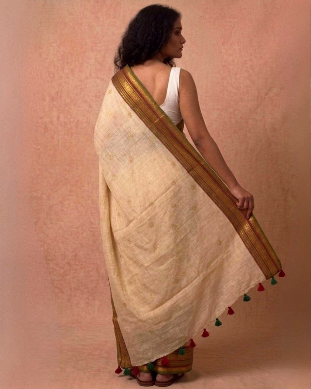 Off white multi color kanchi border mulmul saree