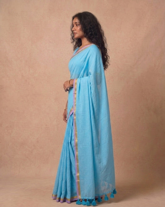 Sky blue mulmul cotton saree with subtle zari border