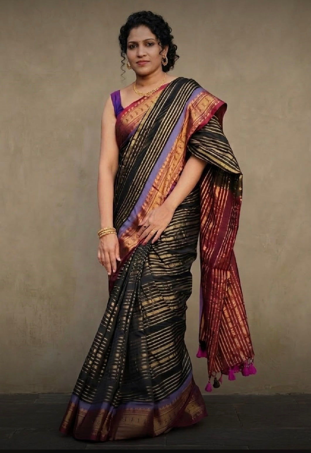 Stunning Traditional Kanchi border Black Saree with Gold Zari Stripes