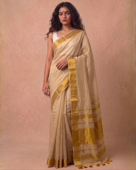 Offwhite golden zari border tissue kasavu saree