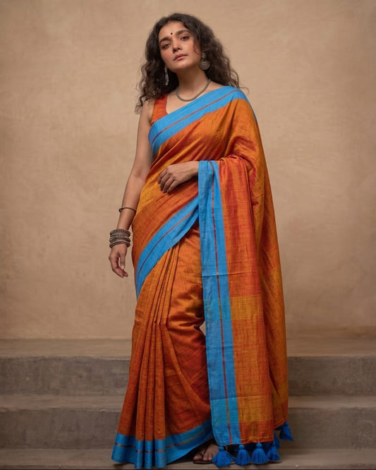 Orange mul cotton saree with blue border