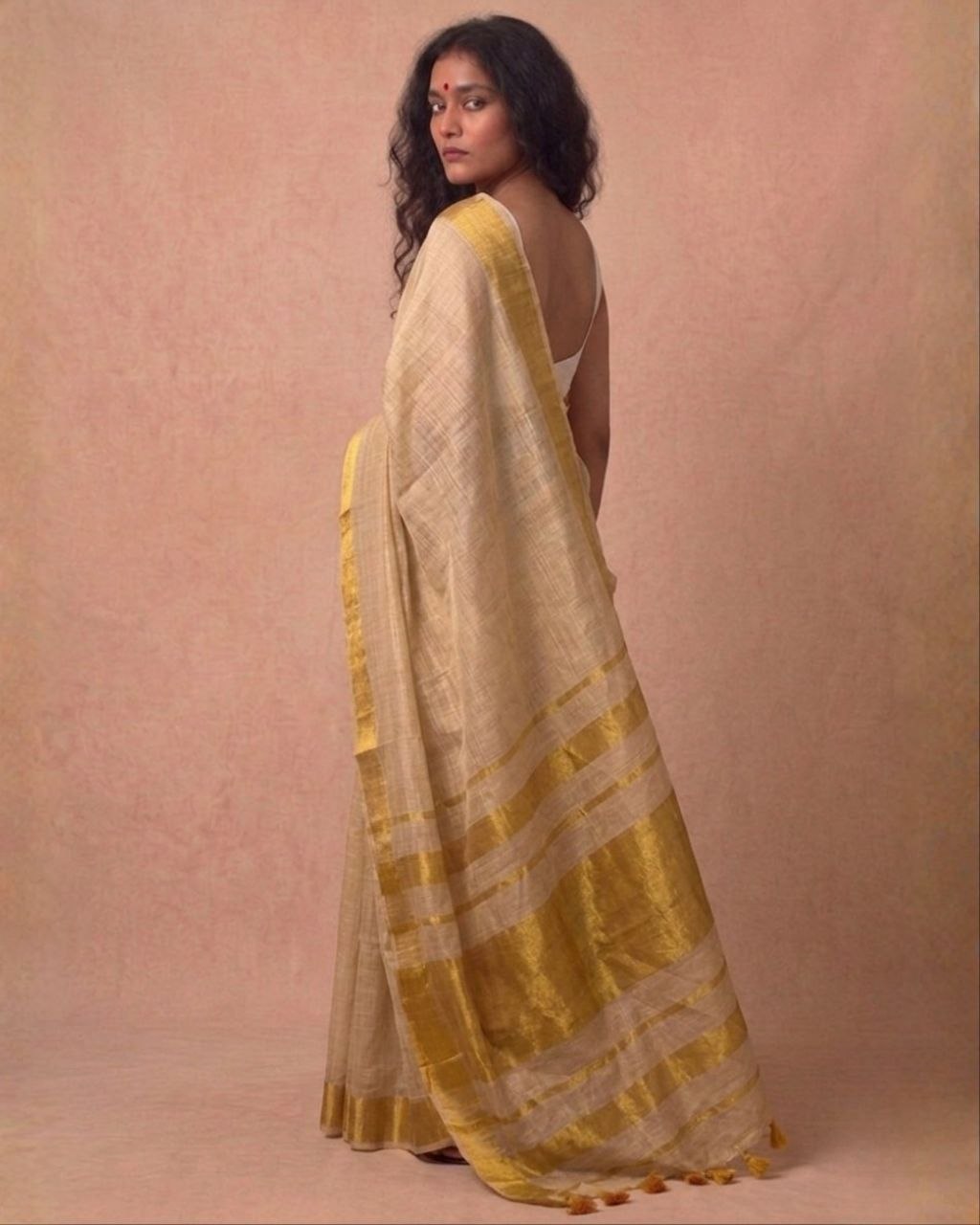 Offwhite golden zari border tissue kasavu saree