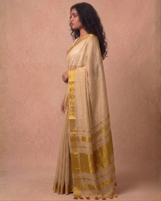 Offwhite golden zari border tissue kasavu saree