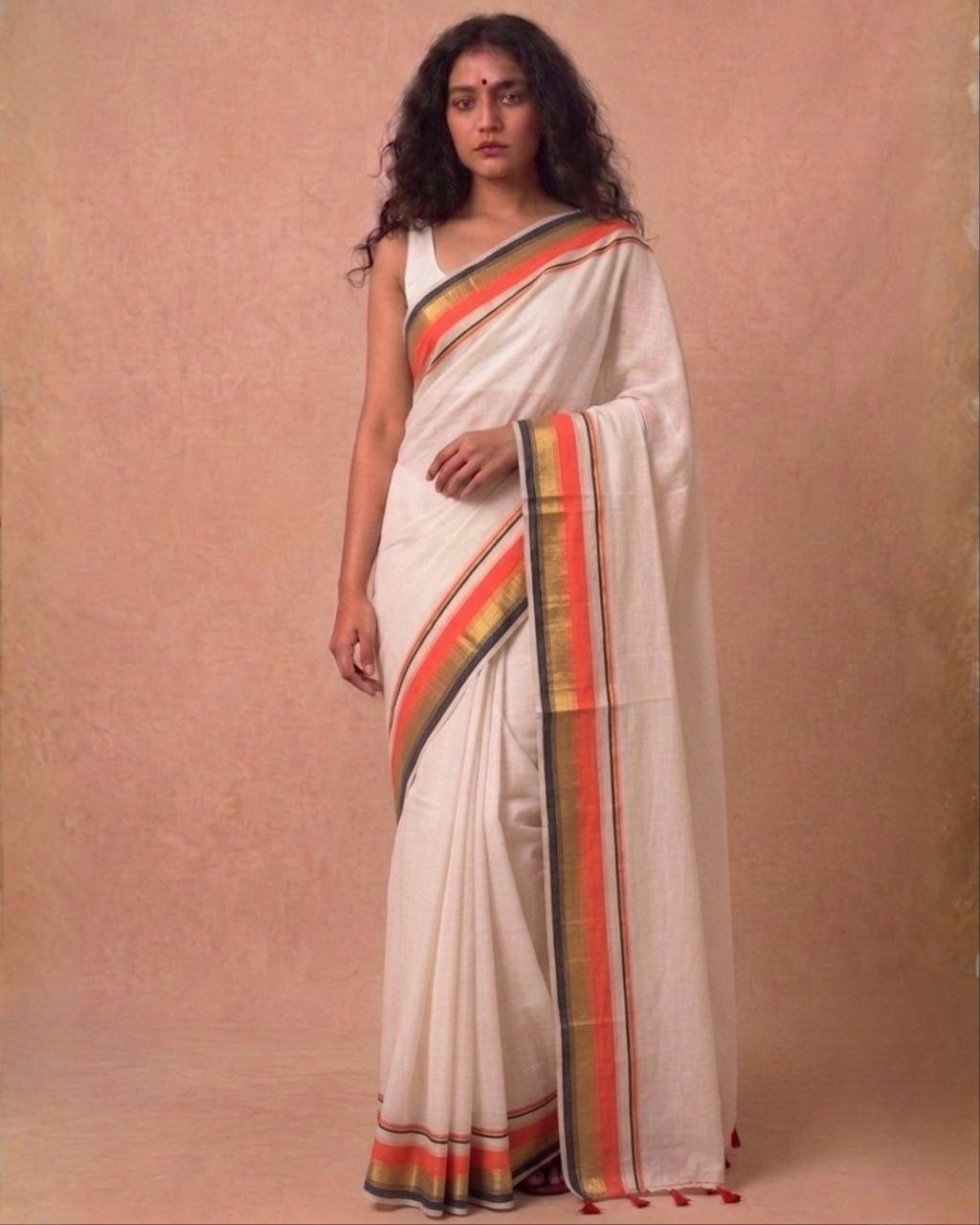 Off white orange zari border mulmul saree