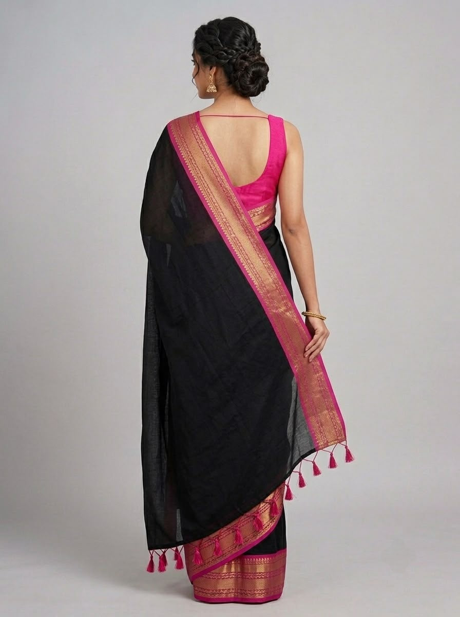 Classic black mulcotton saree with Contrast Pink and Gold Zari Border