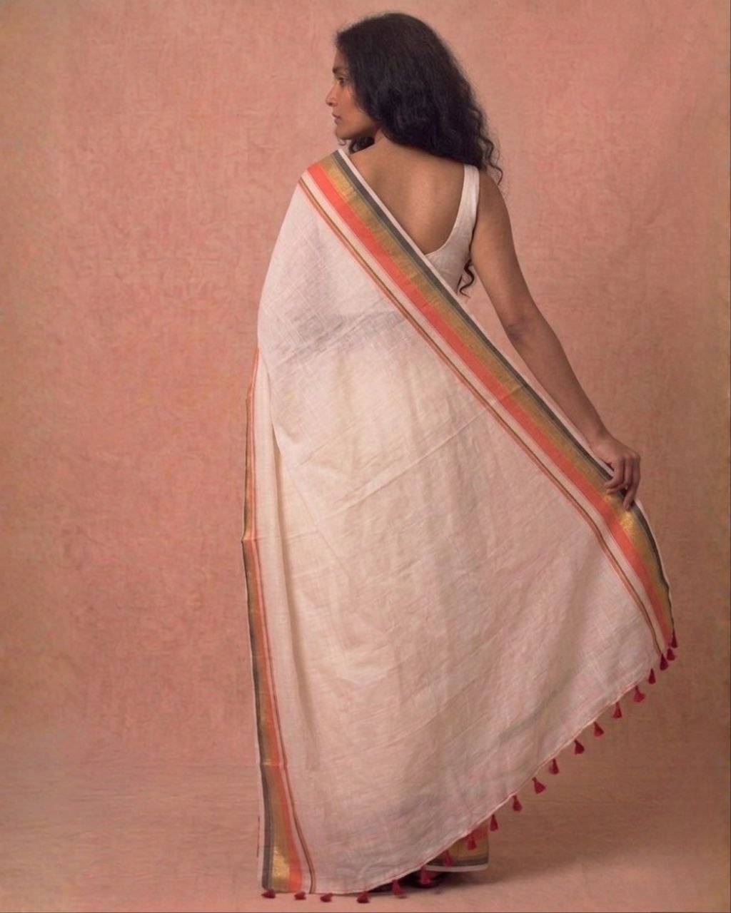 Off white orange zari border mulmul saree