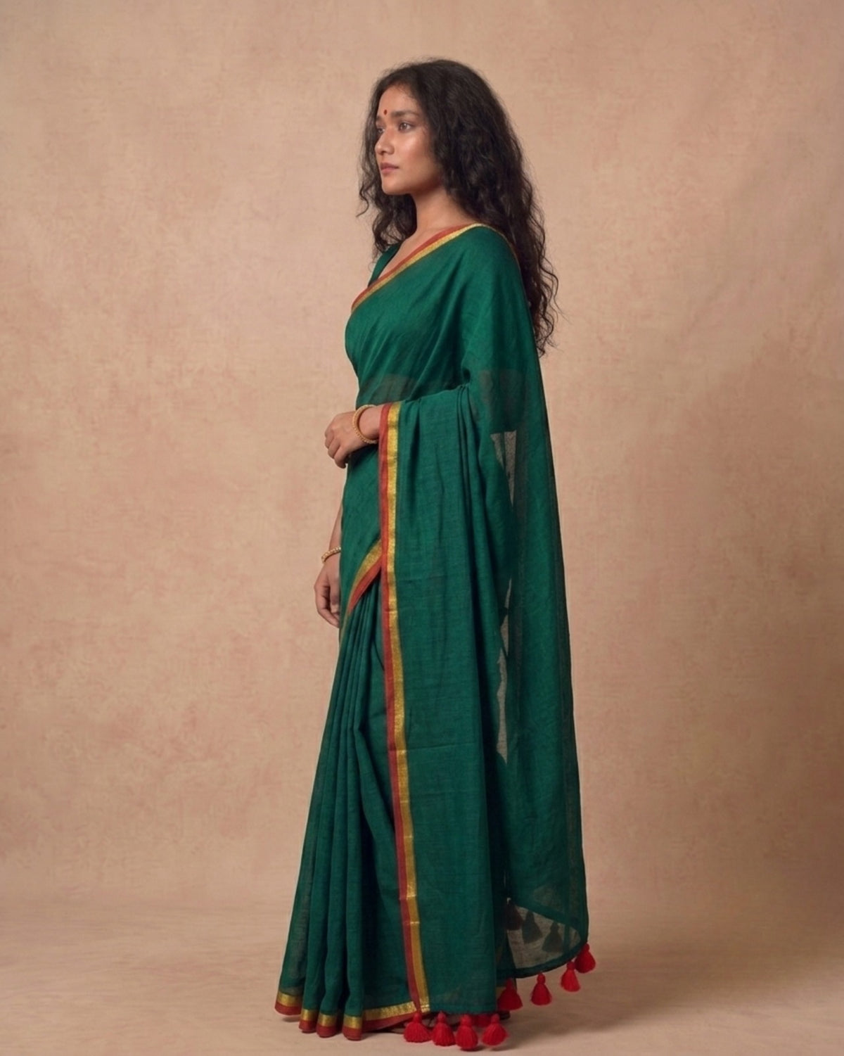 Dark green mulmul cotton saree with red n gold zari border