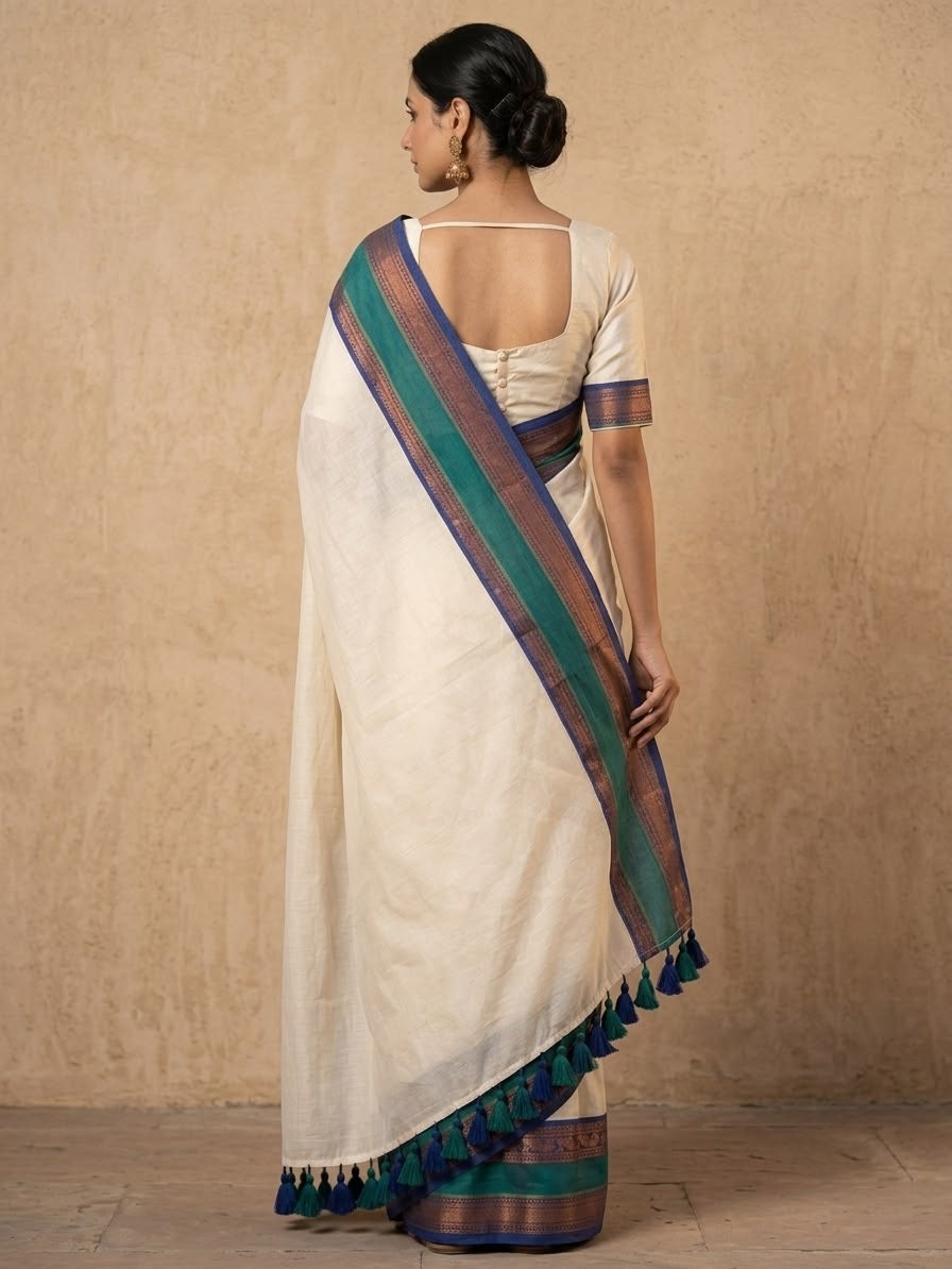 Offwhite mulmul cotton saree with green gold kanchi border