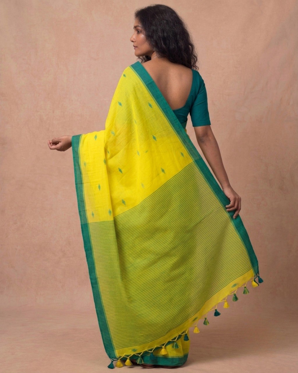 Turmeric yellow handspun cotton saree with green bootis