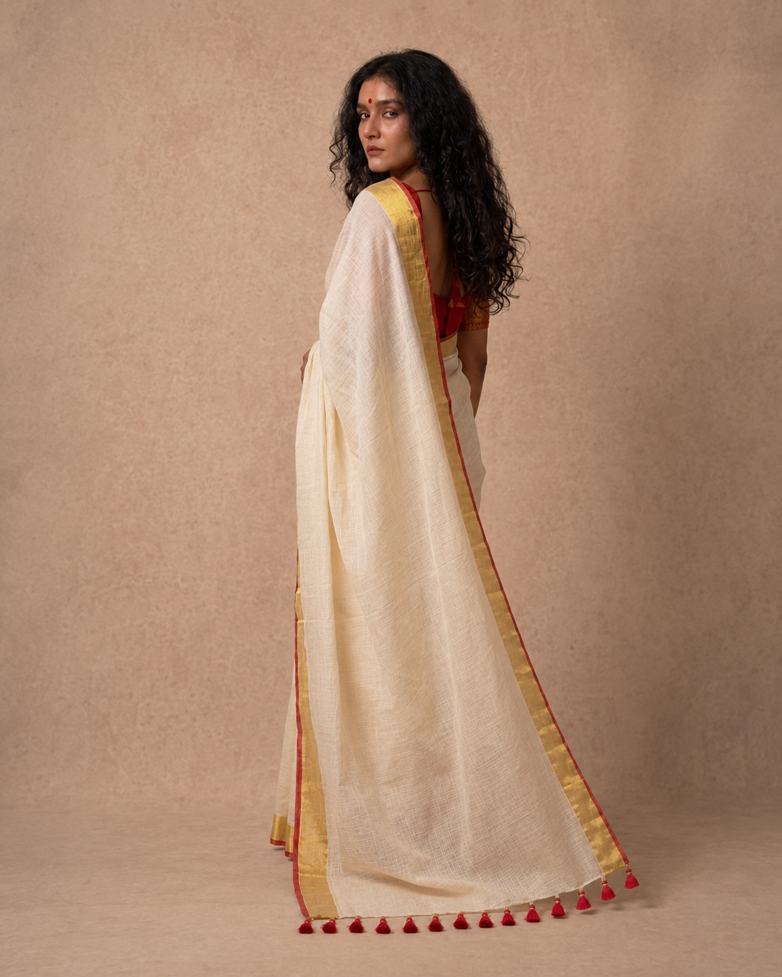 Off white mul cotton saree with red and golden kanchi border