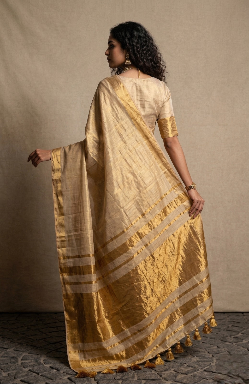 Beige golden zari border tissue kasavu saree