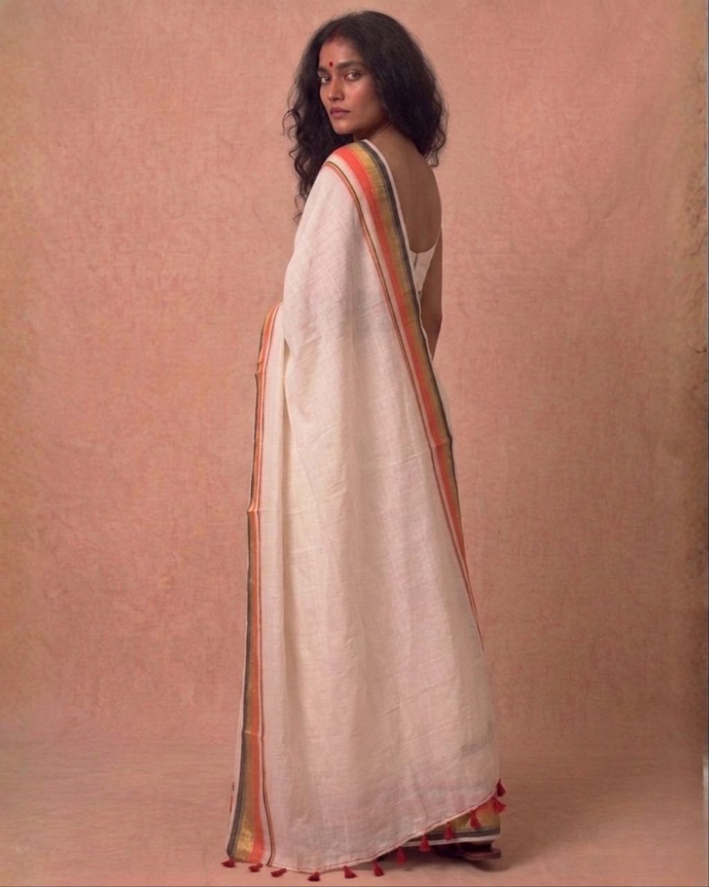 Off white orange zari border mulmul saree