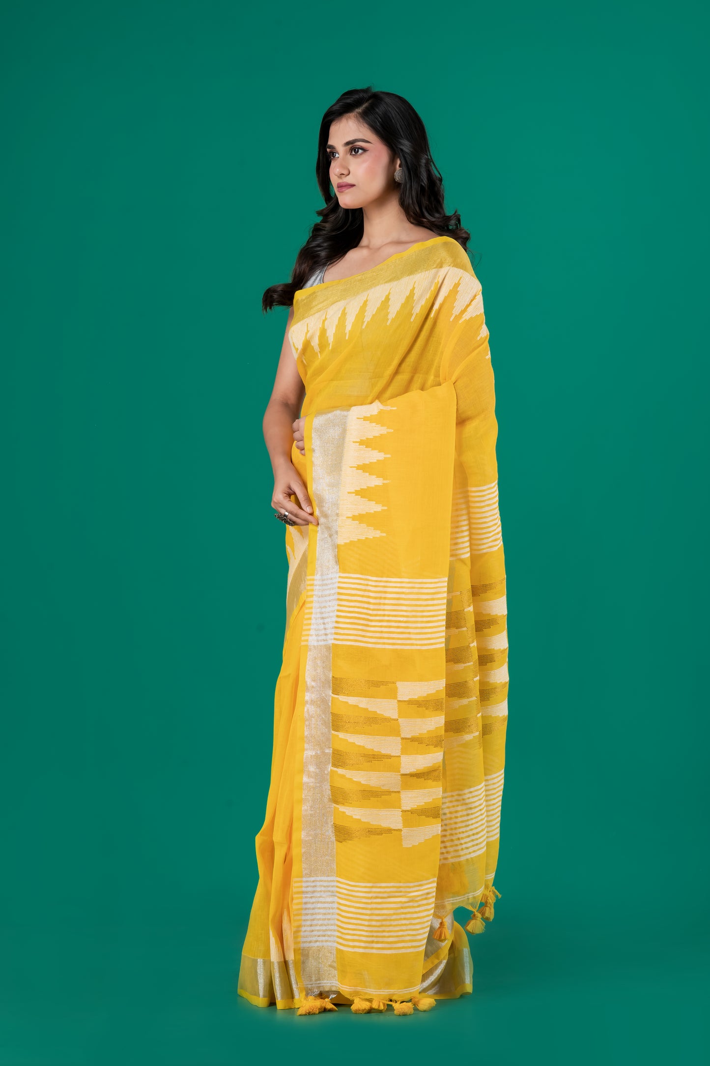 Bright yellow linen saree temple borders