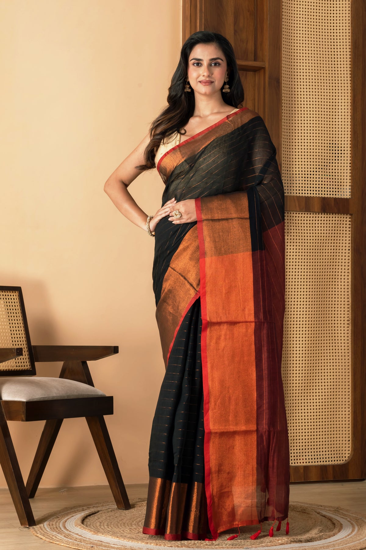 Black mul cotton saree with copper border and  metallic stripes
