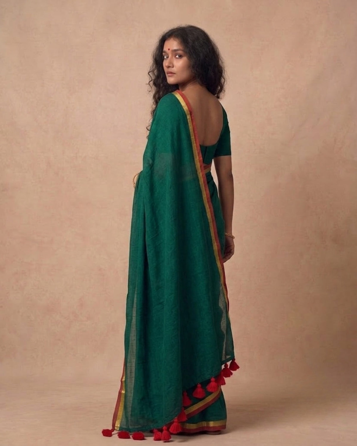 Dark green mulmul cotton saree with red n gold zari border