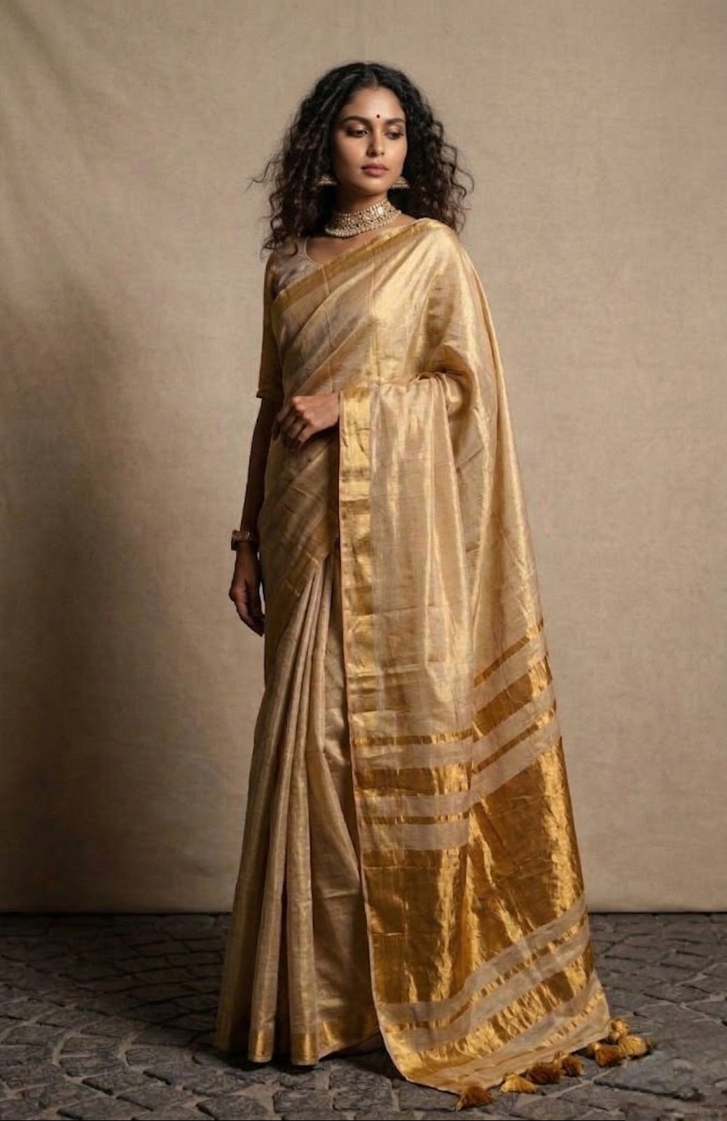 Beige golden zari border tissue kasavu saree