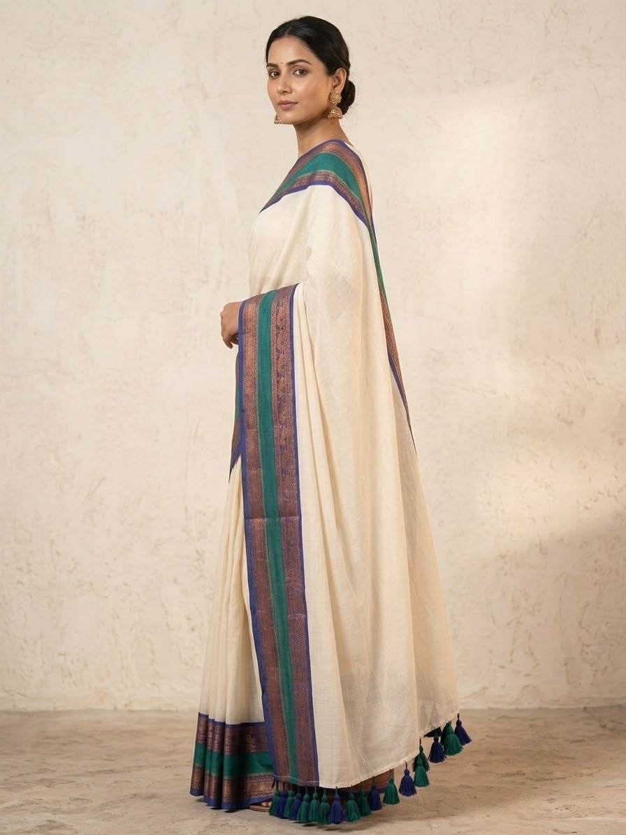Offwhite mulmul cotton saree with green gold kanchi border