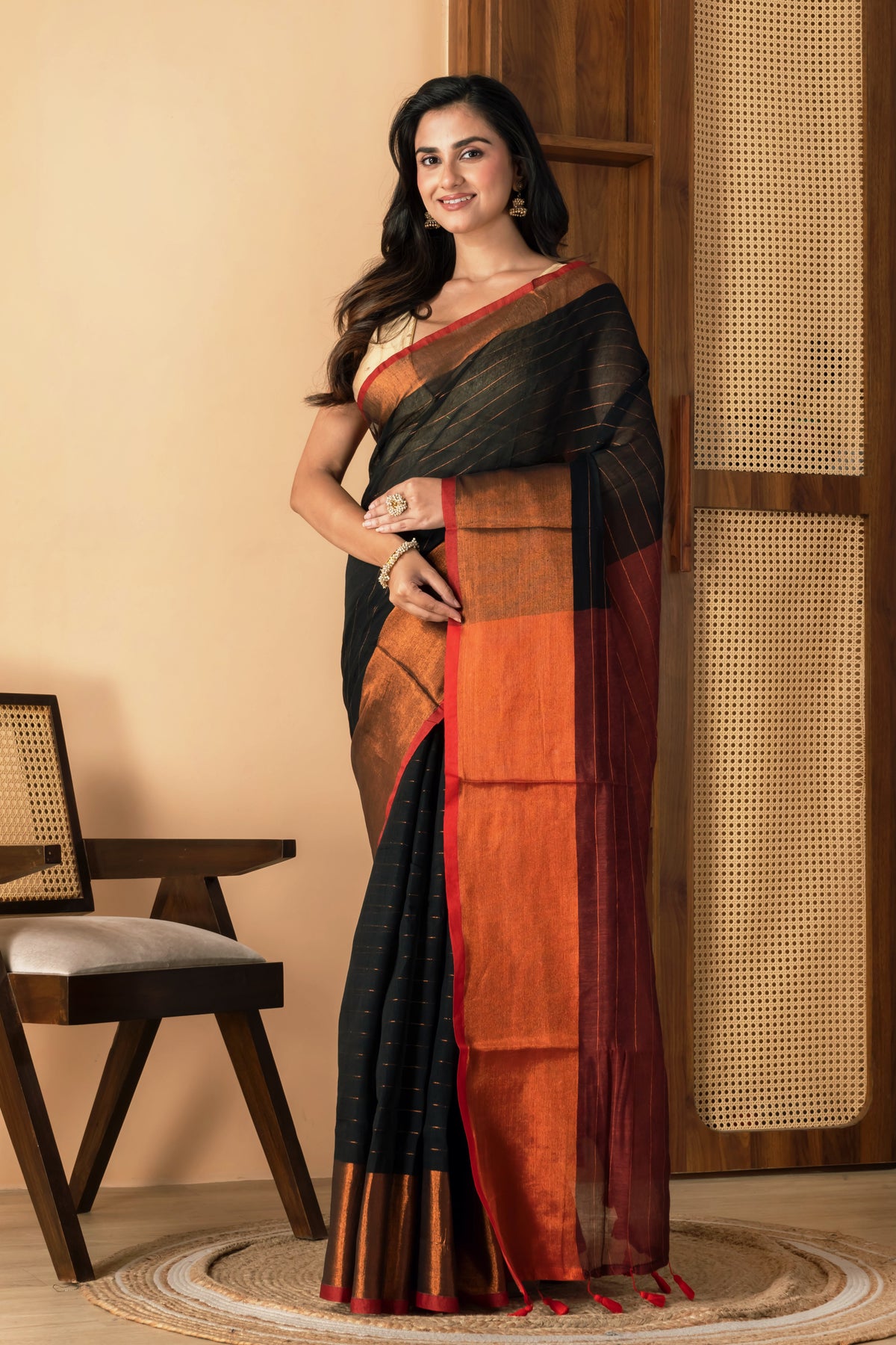 Black mul cotton saree with copper border and  metallic stripes