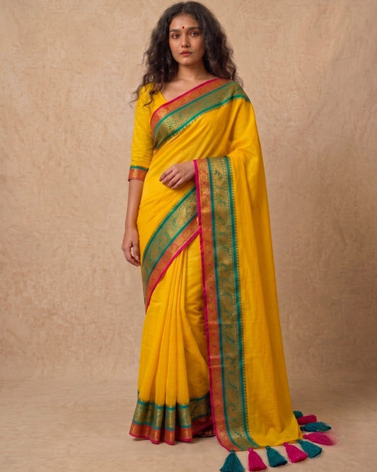 Bright yellow multi color kanchi border mulmul saree