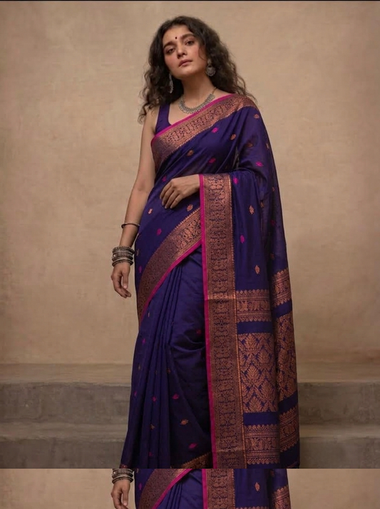 Navy blue handloom saree with contrast pink edging and woven zari pallu