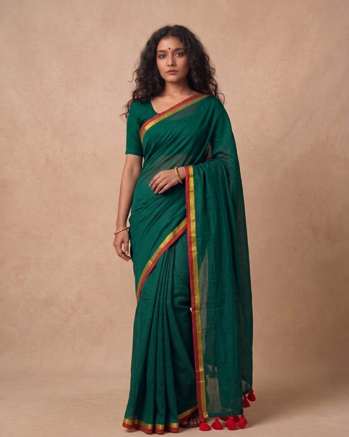 Dark green mulmul cotton saree with red n gold zari border
