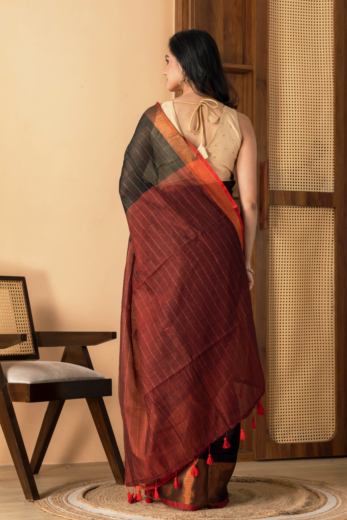 Black mul cotton saree with copper border and  metallic stripes