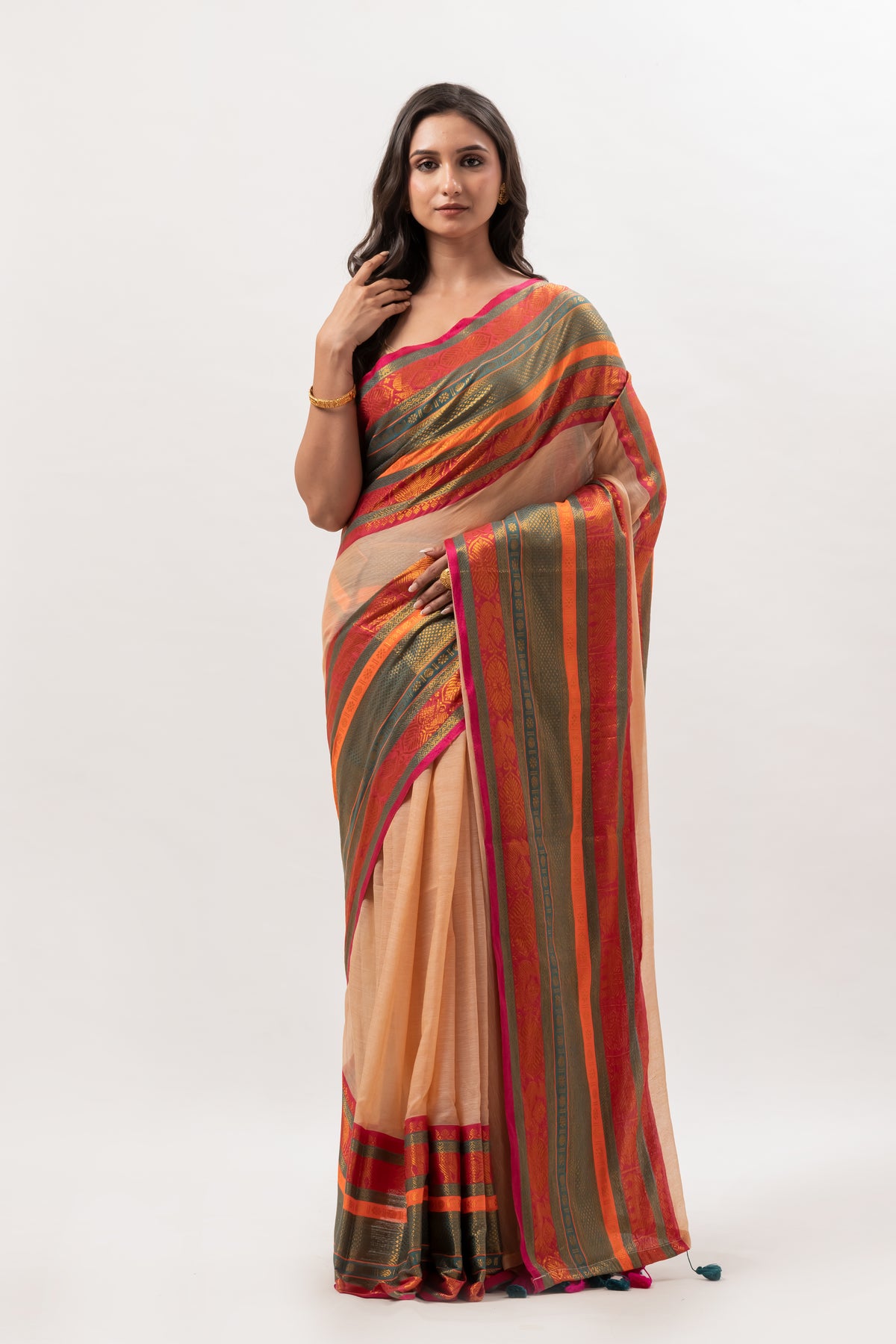 Deep beige mul cotton saree with vibrant green n orange kanchi border
